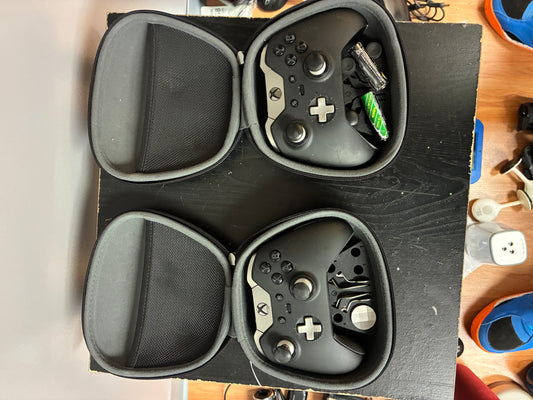 Xbox Elite Series Controller (with hard shell cases and extra paddles visible)