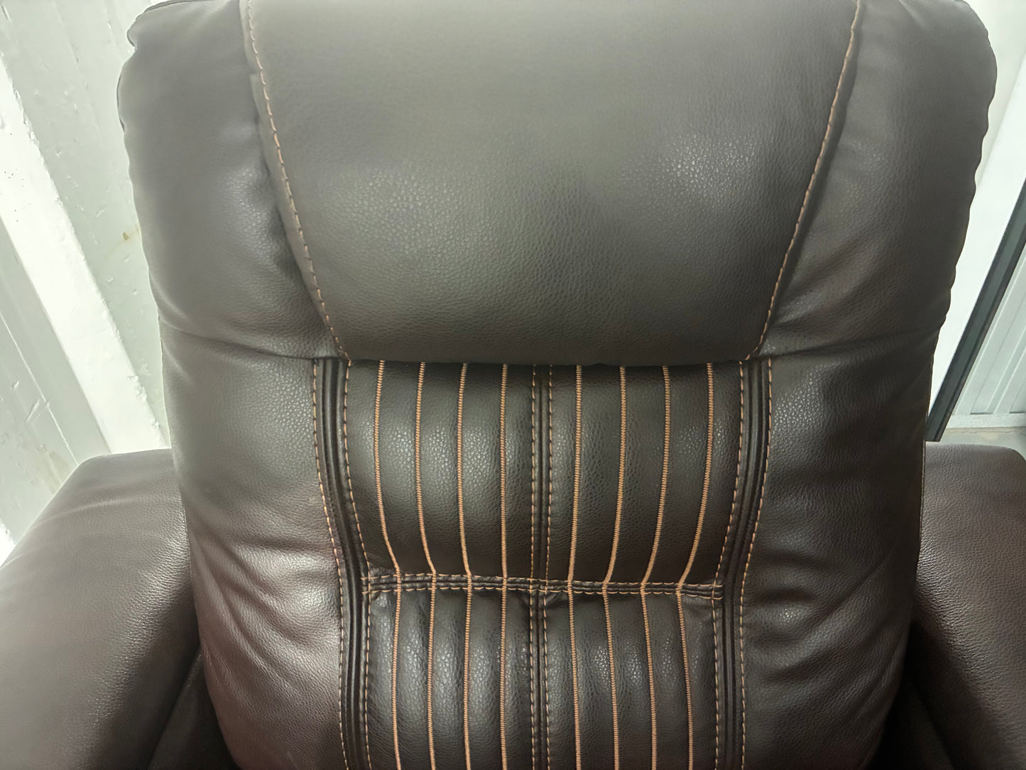 brown leather power recliner theater chair with some premium features.
