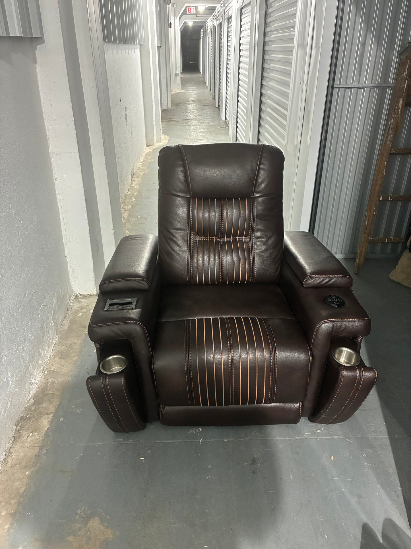 brown leather power recliner theater chair with some premium features.